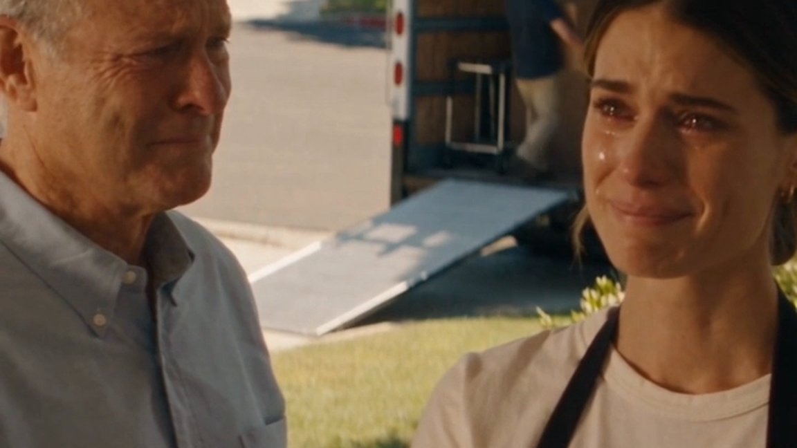 Nicole and her father on moving day in front of the truck — happy tears